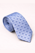 Rolled-up light blue tie with a subtle pattern on a white background